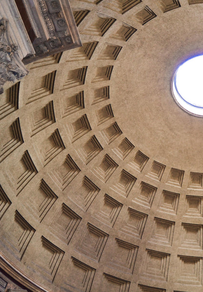 Close-up of a dome with geometric patterns and a light source at the center.